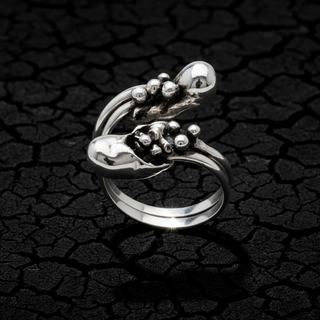 An adjustable sterling silver ring with multiple silver balls cluster ornamentation