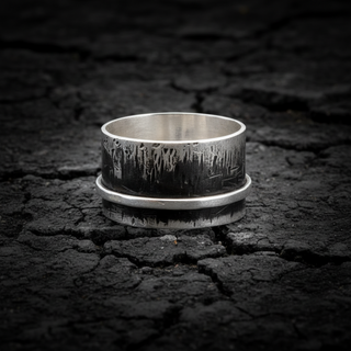 A silver ring with a textured finish